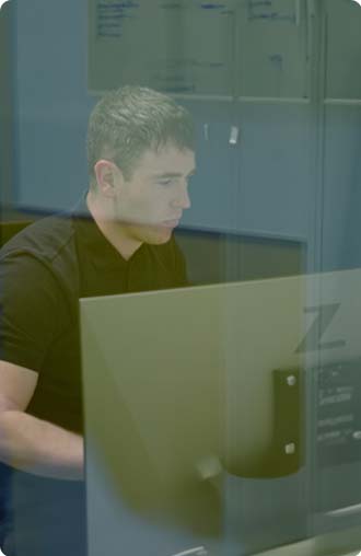 a person working on computer on connected health software