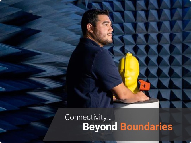 a engineer standing in IoT device testing chamber